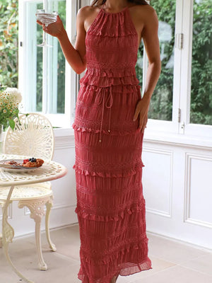 Brick-red halter neck smocked tiered maxi dress with drawstring waist.