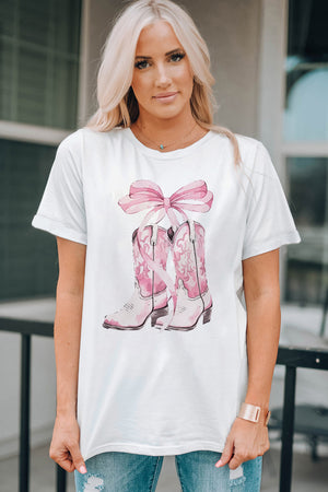 White t-shirt with pink cowboy boot and bow graphic print