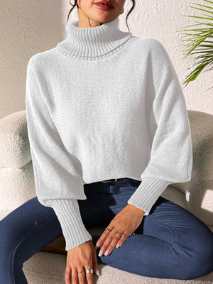 White balloon sleeve turtleneck sweater with ribbed cuffs and collar