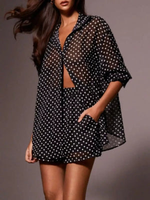 Black sheer polka dot two-piece set with button-up shirt and shorts.