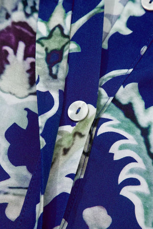 Maxi dress with blue floral print, button front and frilled collar detail.