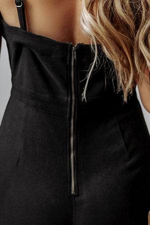 Black structured flare jumpsuit with zip back detail and adjustable straps.