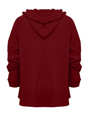 Burgundy textured knit raglan hoodie with a relaxed fit and ruched sleeves.