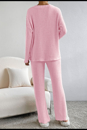 Blush pink ribbed V set loungewear with long sleeves and wide leg pants.