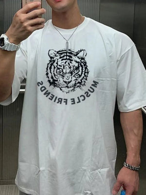 White oversized tee with a black tiger graphic and reversed text.