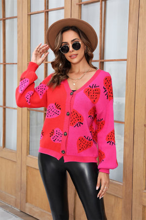 Strawberry patchwork V-neck cardigan in hot pink and red acrylic with button front.