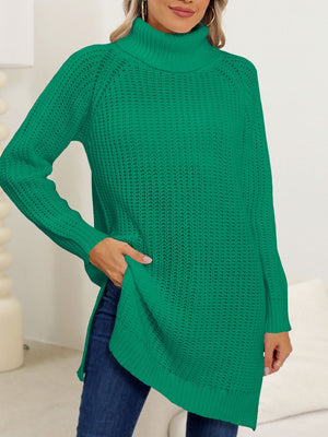 Dark green knit turtleneck sweater with an asymmetric hemline and side slits.