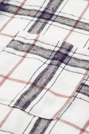 Oversized white shacket with a plaid pattern and chest pocket detail.