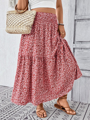 Charming floral print tiered maxi skirt with smocked waist, shown in red.