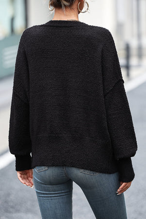 Black textured bouclé button-down cardigan with balloon sleeves