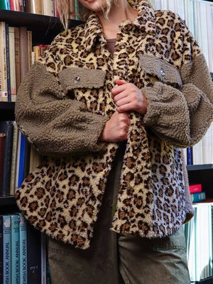 Plush leopard print fleece jacket with button-down front and two chest pockets.