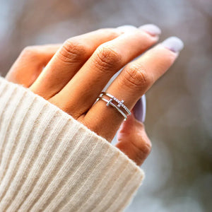 Double Cross Diamond Band Ring in silver with pave diamond detail.