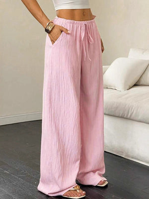 Pink crinkled wide leg pants with drawstring waist and pockets
