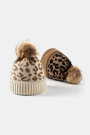 Textured leopard print acrylic beanie with pom pom in beige and black.
