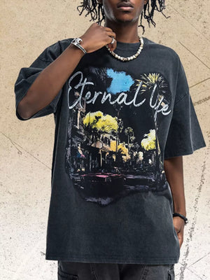 Black cotton graphic t-shirt with "Eternal Life" text and a vintage street scene graphic.