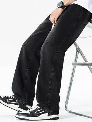 Relaxed wide leg black cotton jeans with drawstring waist and visible stitching.
