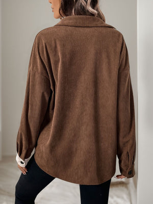 Colorblock corduroy shirt in coffee brown with asymmetrical paneling and buttoned cuffs.