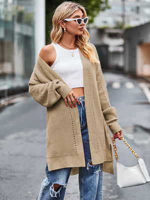 Camel open-stitch waffle knit duster cardigan with long sleeves and side slits.