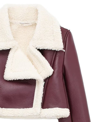 Burgundy cropped aviator jacket with white shearling trim and collar.