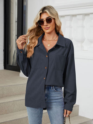 Dark Navy corduroy overshirt with buttoned pockets and collar, long sleeves.