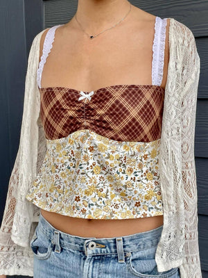 Mixed print corset cami with lace straps and white bow detail, brown plaid and floral pattern