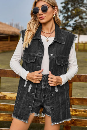 Dark distressed denim sleeveless jacket with frayed hem and button front.