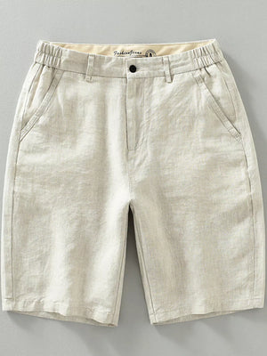 Beige lightweight chino shorts with elastic waistband and pockets.