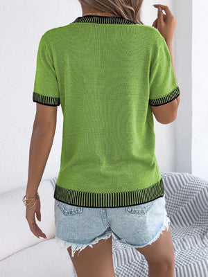 Green knit tee with contrast trim on collar, sleeves, and hem.