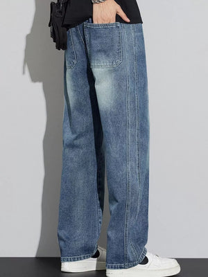 Men's blue wide-leg jeans with drawstring detail and visible stitching.