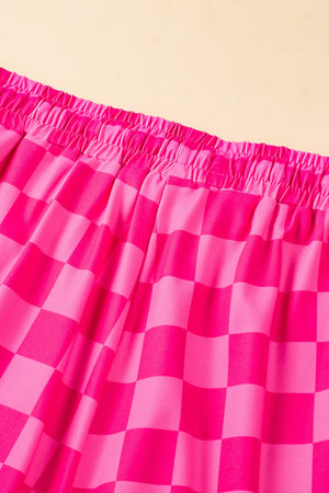 Hot pink checkerboard lounge shorts with elastic waistband