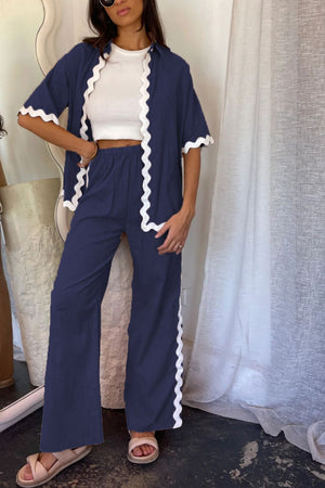 Dark blue scalloped edge co-ord set with short sleeves and wide leg pants.