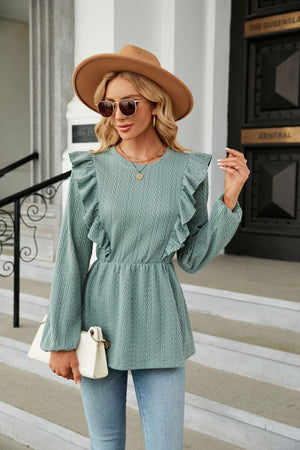 Sage textured ruffle peplum blouse with long sleeves and cinched waist.