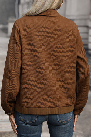 Textured chevron utility jacket in burnt umber with a zip front and collared neckline.