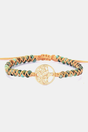 Gold Tree of Life macrame bracelet with turquoise beads and adjustable cord.