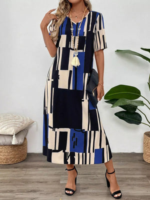 Midi dress with geometric print, V-neck, short sleeves, and a flowy skirt.
