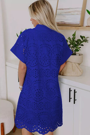 Blue cotton mini dress with allover eyelet embroidery and scalloped hem.