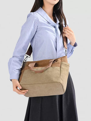 Multi-pocket canvas travel bag in taupe with brown accents and adjustable strap.