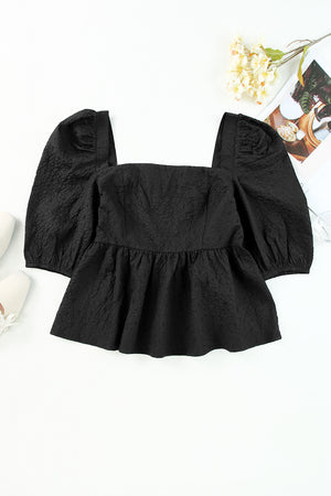 Black textured peplum blouse with square neck and petal puff sleeves