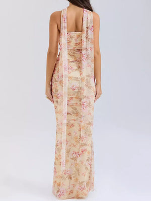 Flowy maxi skirt set with sweetheart tube top in a floral print, featuring a draped scarf detail.