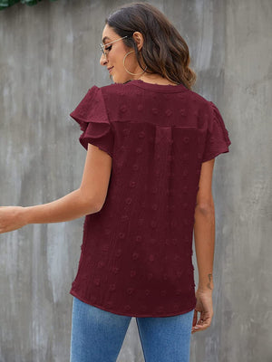 Burgundy textured voile blouse with flutter sleeves and a dotted pattern.
