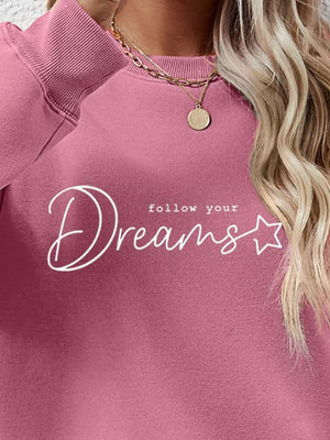 Dreams Scripted Oversized Sweatshirt in Blush Pink with crew neck and white graphic text.