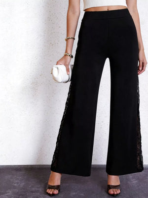Black high-waist wide-leg pants with lace trim detail on the sides.