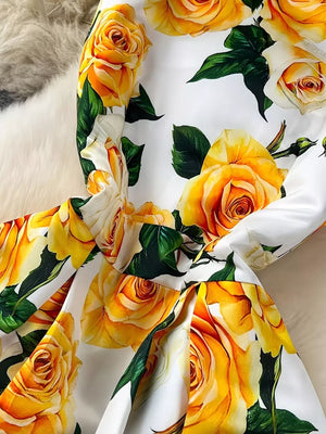 Yellow floral midi dress with pleated skirt and rose print