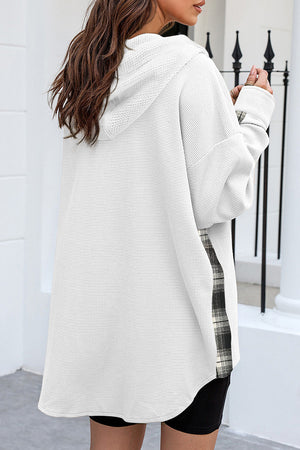White waffle knit shacket with plaid trim detail and hood.