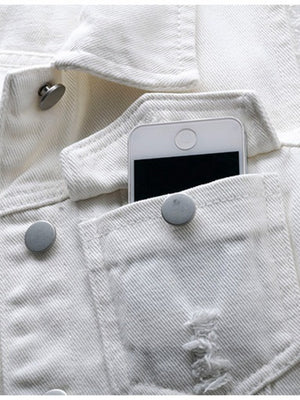 White denim vest with frayed pocket detail and metal buttons, phone in pocket