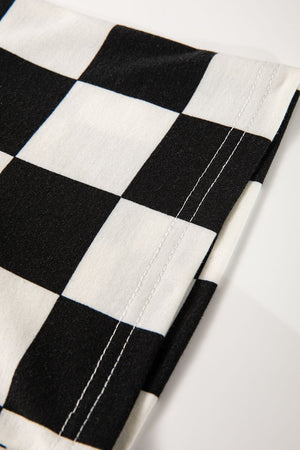 Black and white checkerboard print casual outfit set detail with visible stitching.
