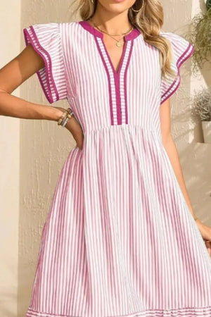 Blush pink striped midi dress with ruffle sleeves and V-neck with contrast trim.