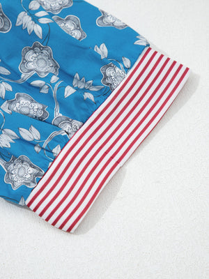 Cotton floral blouse with red and white striped collar detail.