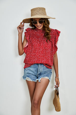Red floral smocked yoke ruffle sleeve blouse with a high neckline.