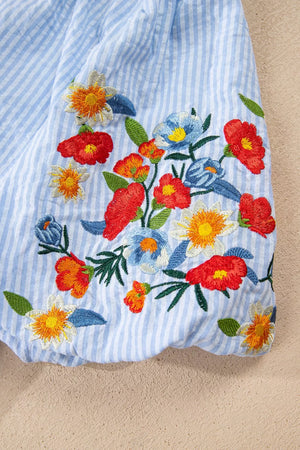 Embroidered floral stripe puff sleeve shirt in blue and white cotton with colorful floral embroidery.